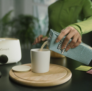 Person pouring milk into container