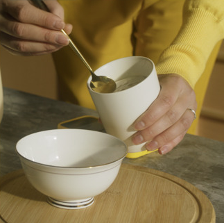 Person serving finished yogurt